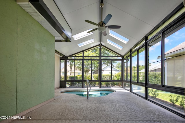 view of swimming pool featuring ceiling fan and a skylight