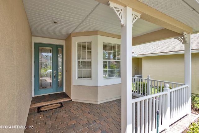 property entrance featuring covered porch