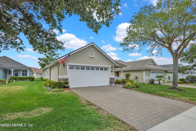 view of front of house featuring a front yard and a garage