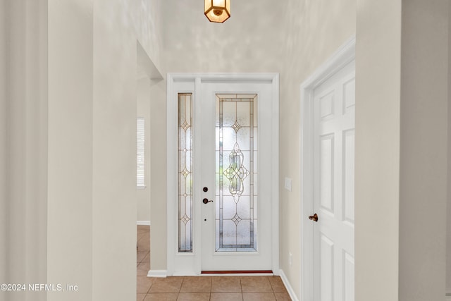 tiled foyer with a wealth of natural light