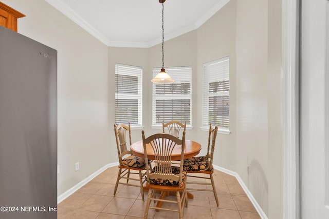 tiled dining room with crown molding