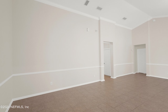 unfurnished room featuring ornamental molding and high vaulted ceiling