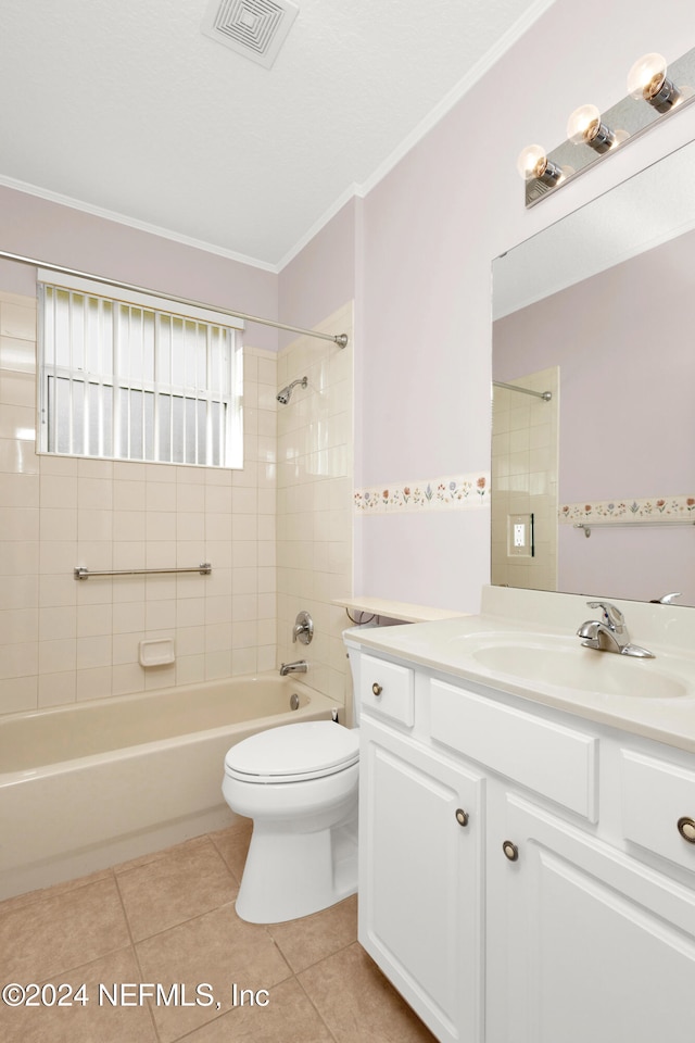 full bathroom featuring vanity, tile patterned floors, tiled shower / bath, and ornamental molding