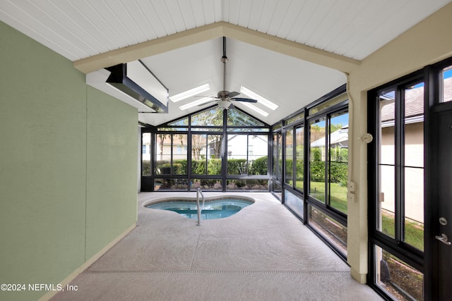 view of swimming pool featuring a skylight