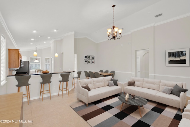 tiled living room featuring ornamental molding, lofted ceiling, and a notable chandelier