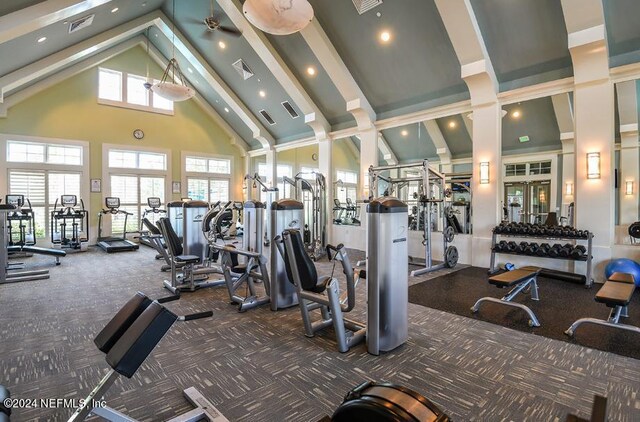 gym featuring high vaulted ceiling, dark carpet, and ceiling fan