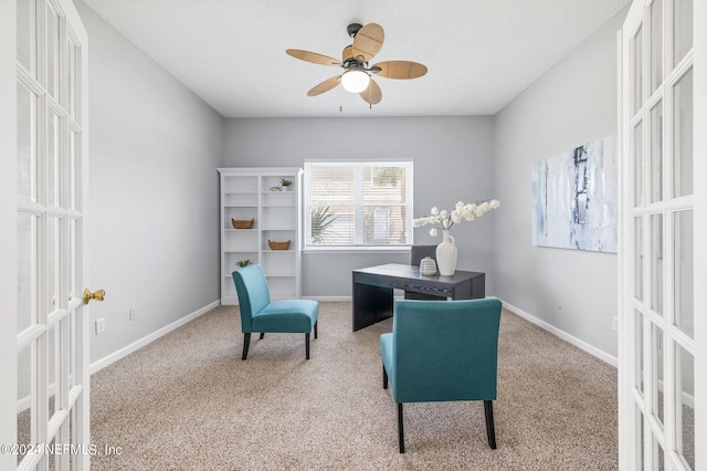 office space featuring french doors, ceiling fan, and carpet floors