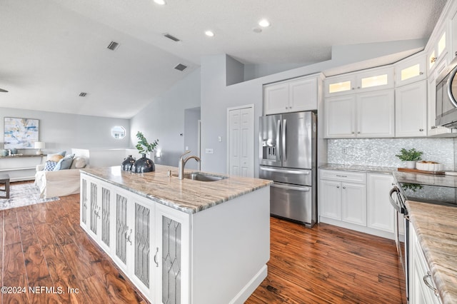 kitchen with sink, appliances with stainless steel finishes, and white cabinets