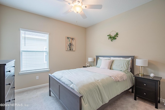 bedroom with light colored carpet and ceiling fan