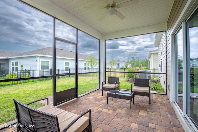 sunroom / solarium with ceiling fan