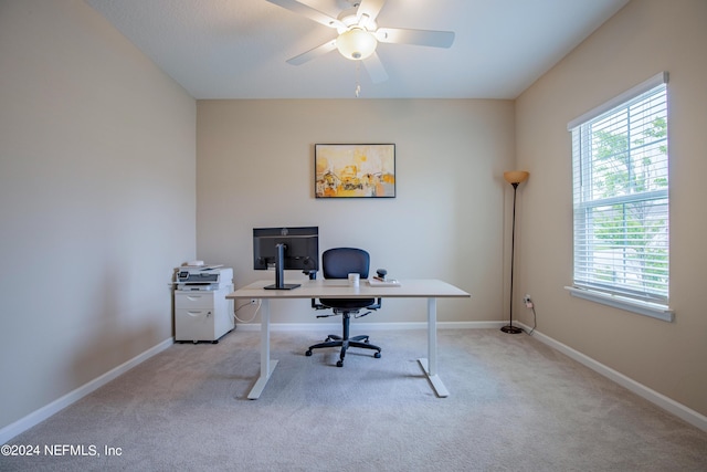 office with light colored carpet and ceiling fan