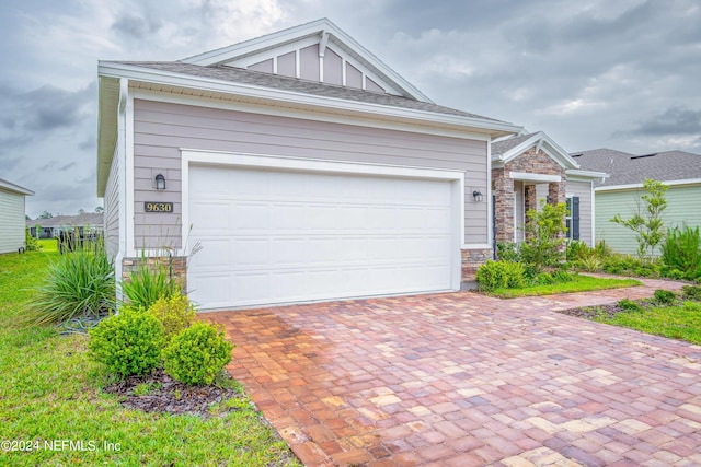 single story home featuring a garage