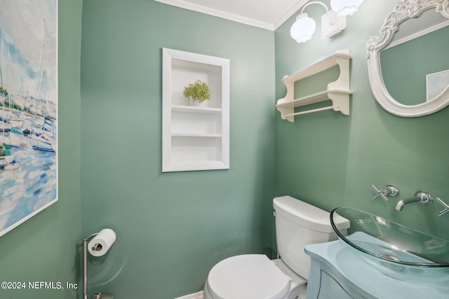 bathroom with vanity, toilet, and ornamental molding