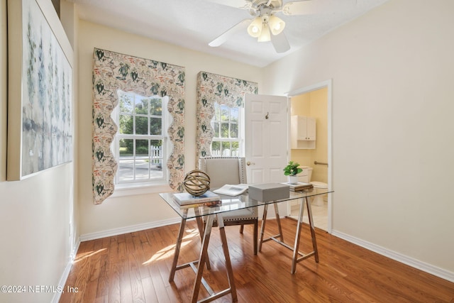 office area with ceiling fan and hardwood / wood-style flooring