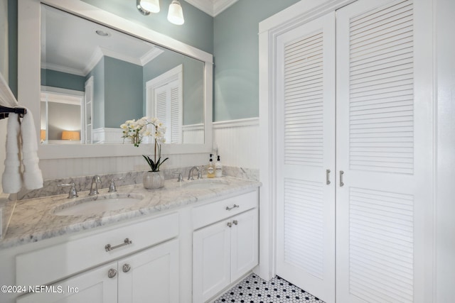 bathroom featuring vanity and ornamental molding