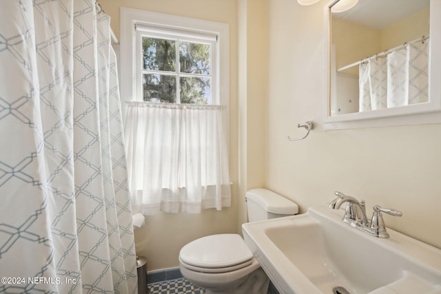 bathroom with sink and toilet