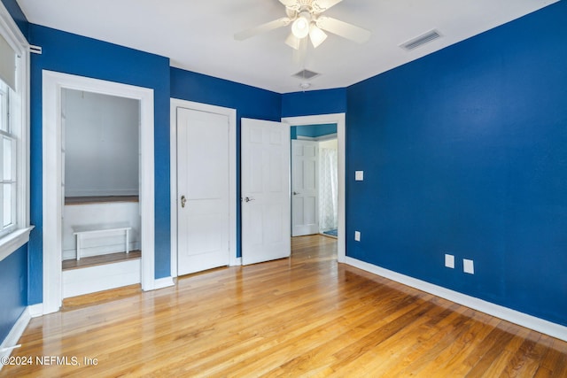 unfurnished bedroom featuring light hardwood / wood-style floors and ceiling fan