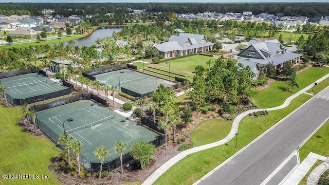 drone / aerial view with a residential view and a water view