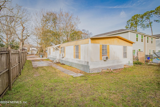 view of side of property featuring a yard