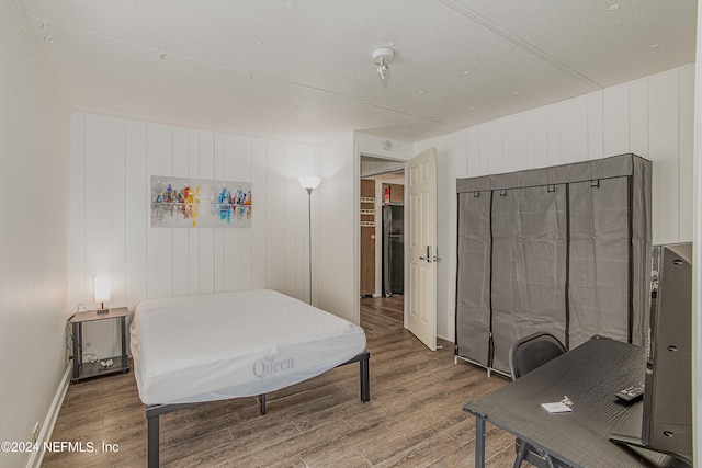 bedroom with hardwood / wood-style floors