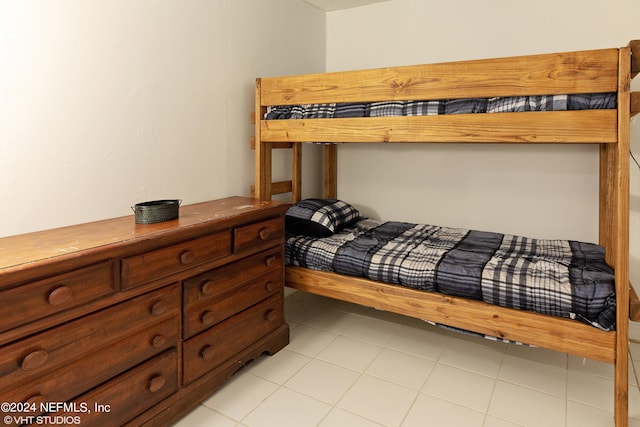 bedroom featuring light tile floors