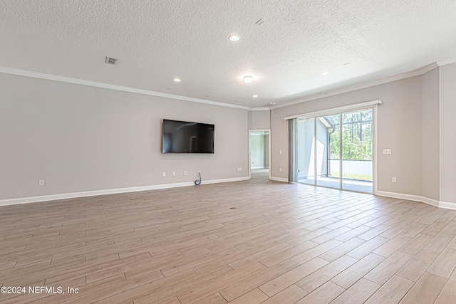 unfurnished living room with a textured ceiling, light wood-type flooring, and ornamental molding