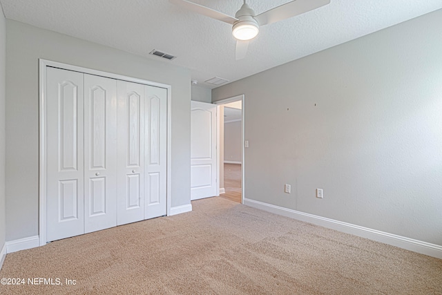 unfurnished bedroom featuring a closet, ceiling fan, and carpet flooring