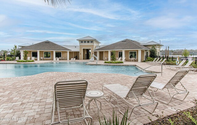 view of swimming pool with a patio