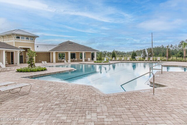 view of pool featuring a patio