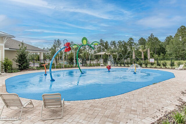 view of swimming pool featuring a patio