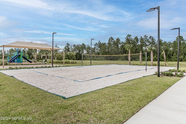 view of home's community with a playground, volleyball court, and a yard