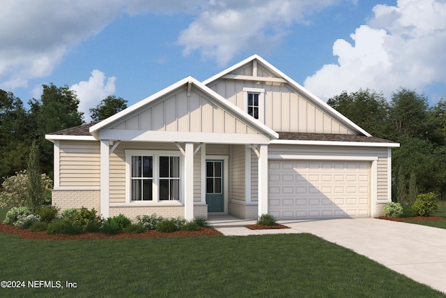 view of front of house with a front yard and a garage