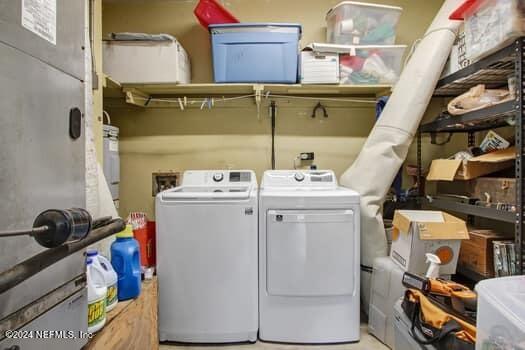 laundry room with independent washer and dryer and hookup for a washing machine