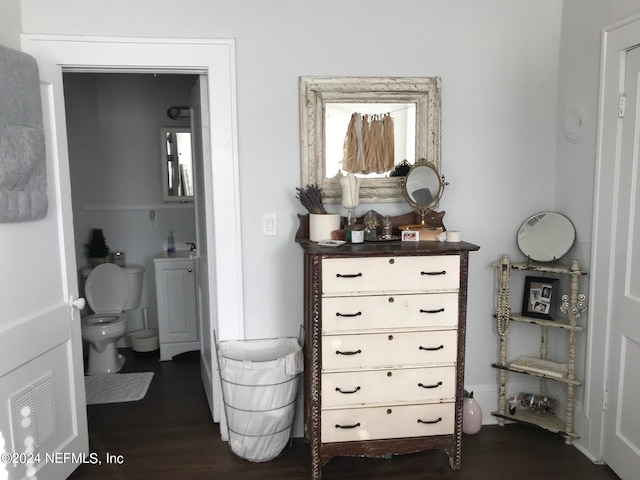 interior space featuring dark hardwood / wood-style floors and ensuite bathroom