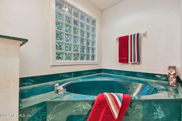 bathroom with a bath to relax in