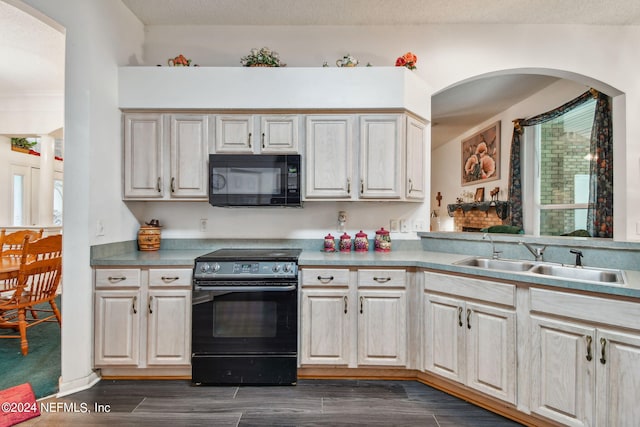 kitchen featuring sink and black appliances