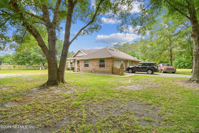 view of home's exterior featuring a lawn and a garage