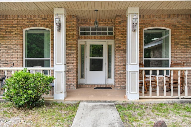 doorway to property with covered porch