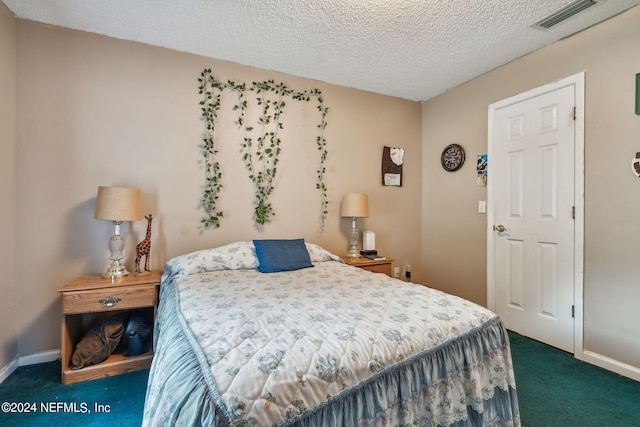 carpeted bedroom with a textured ceiling