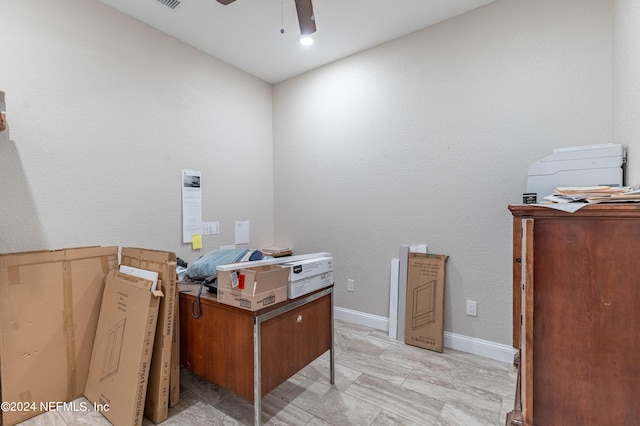 misc room with ceiling fan and light tile floors