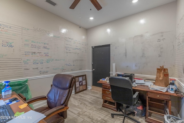 home office featuring light wood-type flooring and ceiling fan