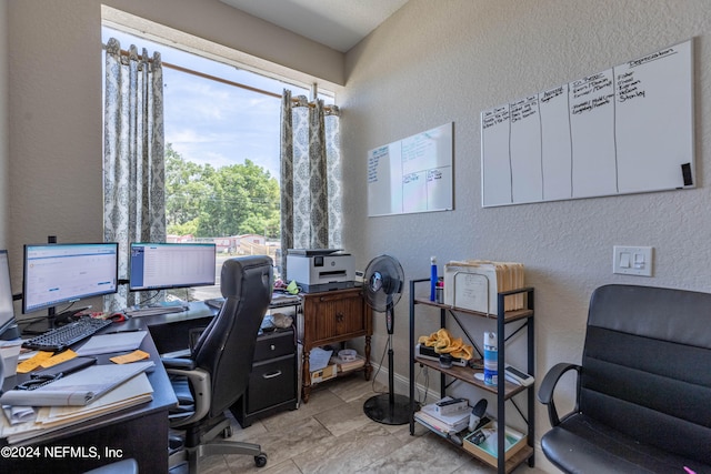 office area featuring a wealth of natural light and light tile floors