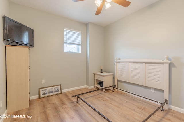 bedroom with ceiling fan and light hardwood / wood-style flooring