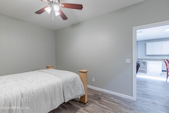 bedroom featuring ceiling fan and hardwood / wood-style floors