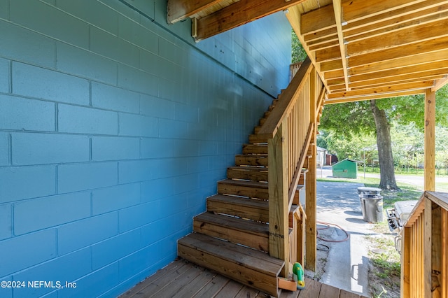 staircase featuring hardwood / wood-style flooring