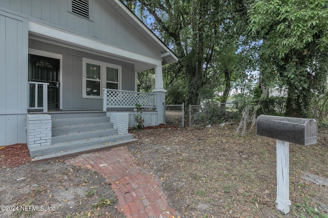 view of yard featuring covered porch