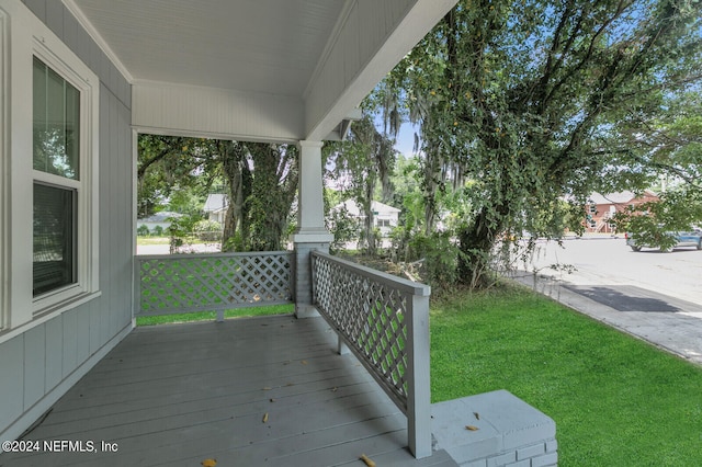 wooden deck with a yard