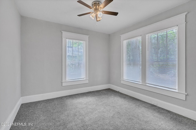 spare room featuring ceiling fan and carpet flooring