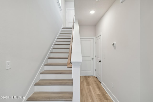 stairs with wood-type flooring