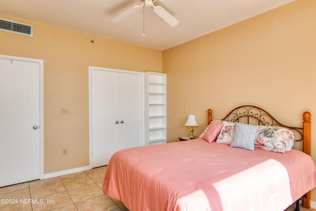 bedroom with tile flooring and ceiling fan